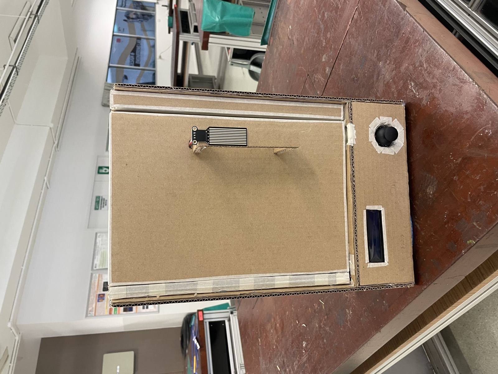 The finished gate closed, with the touch-sensor handle on the door and the LCD and joystick on the base