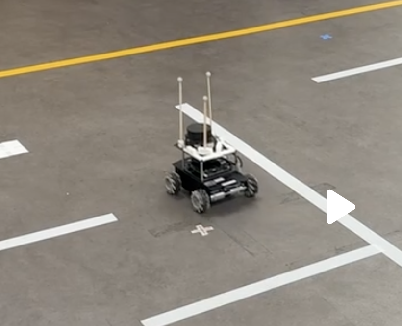The robot on the real maze floor, taking a wider route past the corner